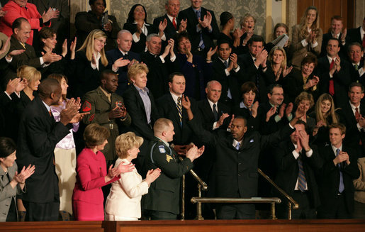 Wesley Autrey receives a standing ovation as President Bush recognizes him during his State of the Union Address at the U.S. Capitol Tuesday evening, Jan. 23, 2007. "Three weeks ago, Wesley Autrey was waiting at a Harlem subway station with his two little girls, when he saw a man fall into the path of a train," said President Bush. "With seconds to act, Wesley jumped onto the tracks, pulled the man into the space between the rails, and held him as the train passed right above their heads. He insists he's not a hero. He says: 'We got guys and girls overseas dying for us to have our freedoms. We have got to show each other some love.' There is something wonderful about a country that produces a brave and humble man like Wesley Autrey." White House photo by Shealah Craighead