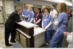 President George W. Bush visits with medical staff on his tour at the Saint Luke’s-Lee’s Summit hospital in Lee’s Summit, Mo., Thursday, Jan 25, 2007. President Bush later participated in a roundtable discussion on health care initiatives. White House photo by Eric Draper