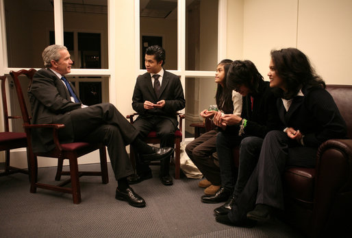 President George W. Bush meets with the family of Cesar Borja, a 20-year veteran of the New York Police Department, who died Jan. 23, 2007, of lung disease. With the President from left is Ceasar Borja Jr., 21; Nhia Borja, 12; Evan Borja, 16, and Officer Borja's wife, Eva Borja. The meeting came during the President's visit to New York City's Freedom Hall Wednesday, Jan. 31, 2007. White House photo by Paul Morse