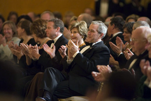 President George W. Bush and Mrs. Laura Bush applaud singer Yolanda Adams in the East Room during a dinner held in honor of the Ford’s Theatre Abraham Lincoln Bicentennial Celebration Sunday, Feb. 11, 2007. "We are here tonight to remember the life -- the incredible life -- and the great sacrifice of the man who saved our Union," said President Bush. "We remember Abraham Lincoln's eloquence, his wisdom, his unshakeable faith in the enduring truth that we're all created equal." White House photo by Paul Morse