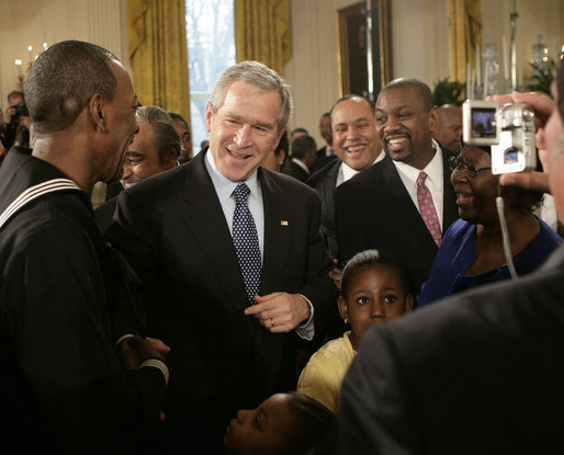 President George W. Bush meets with New York City subway hero Wesley Autrey, left, and members of the Autrey family, in the East Room of the White House, Monday, Feb. 12, 2007, during the celebration of African American History Month. White House photo by Eric Draper