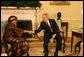 President George W. Bush greets Liberia's President Ellen Johnson-Sirleaf during her visit Wednesday, Feb. 14, 2007, to the White House. President Bush applauded the leader's confidence and deep concern for the people of Liberia, saying, "I thank you very much for setting such a good example for not only the people of Liberia, but for the people around the world, that new democracies have got the capability of doing the hard work necessary to rout out corruption, to improve the lives of the citizens with infrastructure projects that matter." White House photo by Shealah Craighead