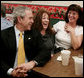 President George W. Bush visits with patrons of Porkers Bar-B-Que restaurant Wednesday, Feb. 21, 2007 in Chattanooga, Tenn., where President Bush stopped by for lunch after attending a forum on health care initiatives at the Chattanooga Convention Center. White House photo by Paul Morse
