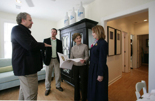 Mrs. Laura Bush talks with Mayor Connie Moran, architect Bruce Tolar, left, and project manager Micah Lewis, center, during a tour of Katrina Cottages, Thursday, Feb. 22, 2007 in Ocean Springs, Miss., the quaint, colorful and quickly built cottages for post-Katrina living. White House photo by Shealah Craighead