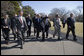 President George W. Bush walks with transportation fuel experts and researchers back to the Oval Office after a demonstration of alternative fuel automobiles on the South Lawn of the White House Friday, Feb. 23, 2007. "Now, it's going to require continued federal research dollars, and I call upon the Congress to fully fund my request for alternative sources of energy," said President Bush. White House photo by Eric Draper