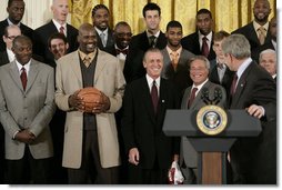 President George W. Bush draws a laugh from the Miami Heat as the 2006 NBA champs visited the White House Tuesday, Feb. 27, 2007. "This is a championship team on the court, and this is a championship team off the court," said the President. "And it is my high honor to welcome them to the White House as NBA champs."  White House photo by Eric Draper