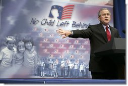 President George W. Bush gestures as he addresses his remarks to students, faculty and guests at the Silver Street Elementary School in New Albany, Ind., Friday, March 2, 2007, urging Congress to reauthorize the No Child Left Behind law.  White House photo by Eric Draper