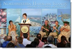 Mrs. Laura Bush is applauded by Hawaiian Gov. Linda Lingle, left, at the Northwest Hawaiian Islands Marine National Monument Naming Ceremony, Friday, March 2, 2007 in Honolulu, where Laura Bush unveiled the new Hawaiian name as the Papahanaumokuakea Marine National Monument. The Northwestern Monument represents the largest single conservation area in our nation's history and the largest protected marine area in the world. White House photo by Shealah Craighead