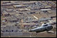 President George W. Bush surveys tornado damage to Enterprise High School from Marine One in Enterprise, Ala., Saturday, March 3, 2007. The President visited people affected by storms in Americus, Ga., and Enterprise, Ala. "We can never replace lives, and we can't heal hearts, except through prayer. And I know -- I want the students to know, and the families to know that there's a lot of people praying for them," said President Bush after walking through Enterprise High School. White House photo by Paul Morse
