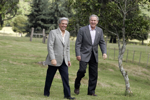 President George W. Bush and President Tabare Vazquez walk to their joint press availability Saturday, March 10, 2007, on the grounds of Estancia Anchorena, the Uruguayan President's retreat. White House photo by Paul Morse