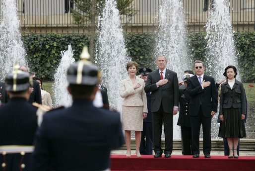President George W. Bush and Mrs. Laura Bush participate in an arrival ceremony with Colombian President Alvaro Uribe and his wife Lina Moreno at Casa de Narino in Bogotá, Colombia, Sunday, March 11, 2007. White House photo by Eric Draper