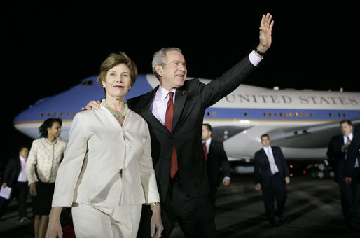 President George W. Bush and Mrs. Laura Bush wave to the crowd on hand for their arrival Sunday, March 12, 2007, at La Aurora Air Force Base in Guatemala City. Guatemala is the fourth stop in their five-country, Latin American visit. White House photo by Eric Draper