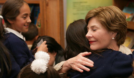 Mrs. Laura Bush hugs a student during her a visit to Rafael Pombo Foundation Sunday, March 11, 2007, in Bogota, Colombia. White House photo by Shealah Craighead