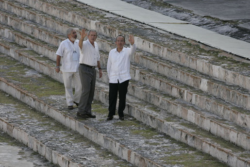 President George W. Bush and Mexico's President Felipe Calderon wave from the steps of the Uxmal Mayan ruins Tuesday, March 13, 2007. White House photo by Paul Morse