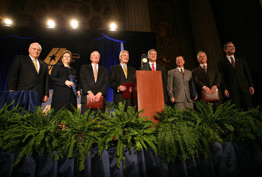 Vice President Dick Cheney, far left, stands with Secretary of Commerce Carlos Gutierrez, far right, and the 2006 Malcolm Baldrige National Quality Award recipients, Tuesday, March 13, 2007 during the 2006 Malcolm Baldrige National Quality Award Ceremony in Washington, D.C. From left the recipients are Kelli Loftin Price and Richard Norling of Premier Inc., San Diego, Calif.; Charles D. Stokes and John Heer of North Mississippi Medical Center of Tupelo, Miss.; John Cole and Terry F. May of MESA Products, Inc., Tulsa, Okla. White House photo by David Bohrer