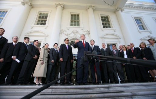President George W. Bush is surrounded by members of the House Republican Conference on the steps of the North Portico Thursday, March 29, 2007, as he delivers a statement on the budget and the emergency supplemental after meeting with the group. Said the President, "We stand united in saying loud and clear that when we've got a troop in harm's way, we expect that troop to be fully funded; and we've got commanders making tough decisions on the ground, we expect there to be no strings on our commanders; and that we expect the Congress to be wise about how they spend the people's money." White House photo by Eric Draper