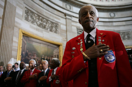 A member of the Tuskegee Airmen stands with his hand over his heart during the National Anthem Thursday, March 29, 2007, at the U.S. Capitol where he and his fellow airmen were bestowed the Congressional Gold Medal, the highest civilian award bestowed by the United States Congress. White House photo by Eric Draper