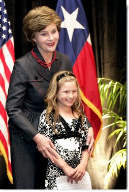 Mrs. Laura Bush hugs Rae Leigh Bradbury Wednesday, April 4, 2007, in Austin, after the 9-year-old introduced Mrs. Bush during the announcement of the future opening of the Texas Regional Office of the National Center for Missing and Exploited Children. Rae Leigh was the first child in the United States to be recovered as a result of an AMBER Alert when she was 8 weeks old in November 1998. So far AMBER Alerts have saved more than 300 young lives in the United States.  White House photo by Shealah Craighead
