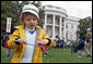 A little boy is careful not to drop his egg as he carries it through the Easter Egg Roll Monday, April 9, 2007, on the South Lawn during the 2007 White House Easter Egg Roll. White House photo by Joyce Boghosian