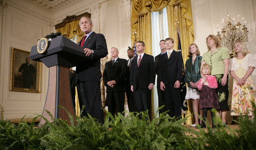 President George W. Bush, joined by military family members, addresses his remarks on the Iraq War supplemental spending bill in the East Room at the White House, Monday, April 16, 2007. President Bush urged Congress to pass an emergency war spending bill, without strings and without further delay. White House photo by Eric Draper