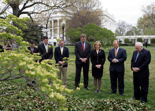 Vice President Dick Cheney stands with Oklahoma City Mayor Mick Cornett, second right, and the Oklahoma Congressional delegation Thursday, April 19, 2007, during a moment of silence on the South Lawn of the White House to commemorate the April 19, 1995 bombing of the Alfred P. Murrah Federal Building in Oklahoma City. The moment of silence was observed in front of a White Dogwood tree planted by former President Bill Clinton and Mrs. Hillary Clinton in honor of the 168 people who lost their lives in the tragedy. White House photo by Eric Draper
