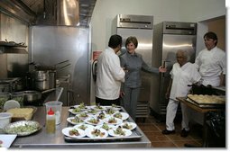 Mrs. Laura Bush tours the new kitchen at Willie Mae’s Scotch House Thursday, April 19, 2007, in New Orleans, La. The restaurant was destroyed in Hurricane Katrina. Pictured with Mrs. Bush are, from left, Willie Mae’s grandson Ronnie Seaton, Sr., 93-year-old Willie Mae Seaton, and Chef John Besh of Restaurant August. White House photo by Shealah Craighead