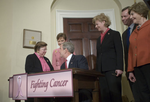 President George W. Bush shakes hands with Senator Barbara Mikulski (D-Md.), sponsor of H.R. 1132, the National Breast and Cervical Cancer Early Detection Program Reauthorization Act, after signing the bill Friday, April 20, 2007 in the Roosevelt Room of the White House. With them are, from right: Mrs. Laura Bush, Secretary Michael Leavitt of the Department of Health and Human Services, Wisconsin Congresswoman Tammy Baldwin, sponsor of the bill, and North Carolina Congresswoman Sue Myrick, co-sponsor of the bill. White House photo by Shealah Craighead