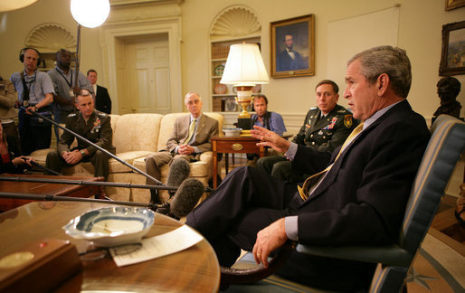 President George W. Bush delivers a statement on the War in Iraq during a visit Monday, April 23, 2007, by Gen. David Petraeus, Commander of the Multinational Force-Iraq, to the White House. Said the President, "I will strongly reject an artificial timetable withdrawal and/or Washington politicians trying to tell those who wear the uniform how to do their job." With them is Gen. Peter Pace, Chairman of the Joint Chiefs of Staff, left, and Gordon England, Deputy Secretary of Defense. White House photo by Eric Draper