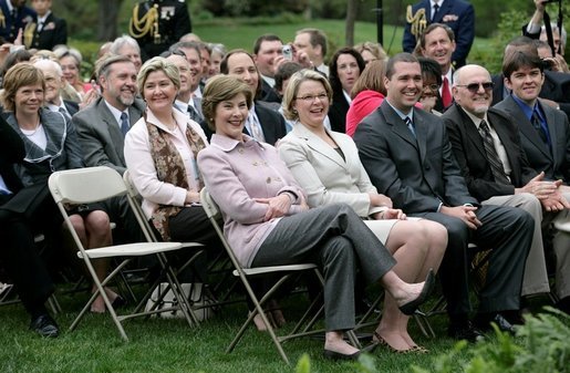 Mrs. Laura Bush and Secretary Margaret Spellings of the Department of Education, smile as they listen to remarks by President George W. Bush during Rose Garden ceremonies Thursday, April 26, 2007, honoring the 2007 Teachers of the Year. White House photo by Eric Draper