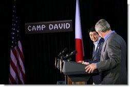 President George W. Bush and Prime Minister Shinzo Abe of Japan exchange nods as they open a joint press availability Friday, April 27, 2007, at Camp David. The meeting marked the first visit by Prime Minister Abe since coming to office.  White House photo by Eric Draper