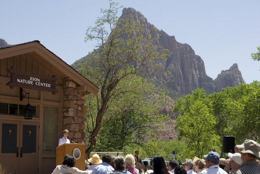 Mrs. Laura Bush delivers remarks, Sunday, April 29, 2007, during the rededication ceremony of the Zion National Park Nature Center in Springdale, Utah. Zion was Utah’s first National Park, originally established as Mukuntuweap National Monument and change to Zion National Monument in 1919. High plateaus, a maze of narrow, deep sandstone canyons and striking rock towers and mesas characterize the park. White House photo by Shealah Craighead