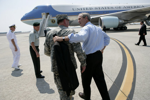 President George W. Bush walks with General David Petraeus, Commander of Multinational Force Iraq, as he prepares to board Air Force One Tuesday, May 1, 2007, after visiting CENTCOM at MacDill Air Force Base in Tampa, Fla. White House photo by Eric Draper