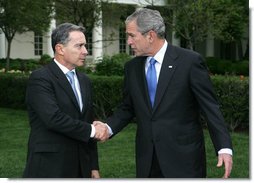 President George W. Bush and Colombia's President Alvaro Uribe exchange handshakes after delivering remarks Wednesday, May 2, 2007, on the South Lawn. President Uribe's visit underscores the friendship and extensive cooperation between the two countries. White House photo by Joyce N. Boghosian