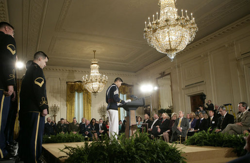Cadet Chaplain Eun-Jae Yu, of the Virginia Tech Corps of Cadets, delivers the 2007 Prayer for the Nation to President George W. Bush and guests during an observance Thursday, May 3, 2007, of National Prayer Day in the East Room of the White House. White House photo by Eric Draper