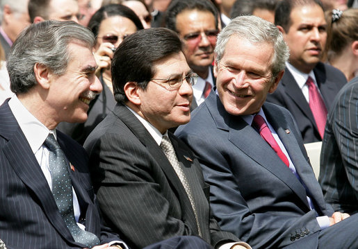 President George W. Bush is joined by U.S. Attorney General Alberto Gonzalez, center, and U.S. Secretary of Commerce Carlos Gutierrez in the Rose Garden at the White House Friday, May 4, 2007, during a celebration of Cinco de Mayo and to recognize the contributions of Mexican Americans. White House photo by Eric Draper