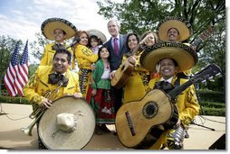 President George W. Bush poses with members of the Los Hermanos Mora Arriaga mariachi band, who performed in the Rose Garden at the White House Friday, May 4, 2007, during a celebration of Cinco de Mayo. White House photo by Eric Draper