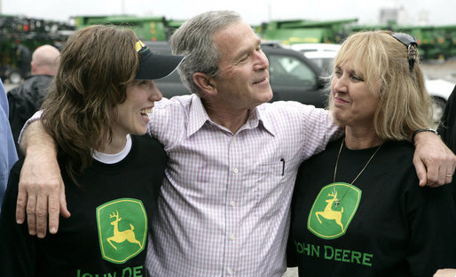 President George W. Bush offers some encouragement to two employees of the John Deere dealership in Greensburg, Kansas Wednesday, May 9, 2007, during a tour of the small, Midwest community that lost nearly 95 percent of its homes and businesses in the wake of a deadly tornado. White House photo by Eric Draper