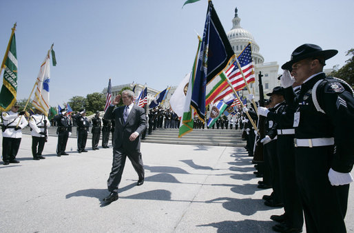 President George W. Bush salutes the color guard as he arrives at the annual Peace Officers’ Memorial Service outside the U.S. Capitol Tuesday, May 15, 2007, paying tribute to law enforcement officers who were killed in the line of duty during the previous year and their families. White House photo by Joyce Boghosian