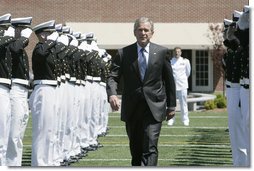 President George W. Bush is saluted by an honor cordon of U.S. Coast Guard cadets on his arrival to address the graduates Wednesday, May 23, 2007, at the U.S. Coast Guard Academy commencement in New London, Conn.  White House photo by Joyce Boghosian
