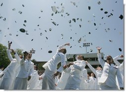 Following President George W. Bush’s address to U.S. Coast Guard Academy graduates Wednesday, May 23, 2007, in New London, Conn., cadets toss their hats into the air. White House photo by Joyce N. Boghosian