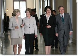 Mrs. Laura Bush is joined by U.S. Senators Kay Bailey Hutchison, R-Texas, left, Dianne Feinstein, D-Calif. and Mitch McConnell, R-Ky, right, as she arrives to attend the Senate Women’s Caucus Wednesday, May 23, 2007 at the U.S. Capitol in Washington, D.C., calling for the unconditional release of Nobel laureate and Myanmar opposition leader Aung San Suu Kyi. White House photo by Shealah Craighead