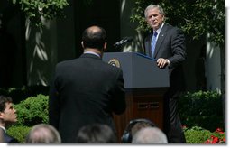 President George W. Bush listens to a question Thursday, May 24, 2007, during a press conference in the Rose Garden. The President said, "Today, Congress will vote on legislation that provides our troops with the funds they need. It makes clear that our Iraqi partners must demonstrate progress on security and reconciliation. As a result, we removed the arbitrary timetables for withdrawal and the restrictions on our military commanders that some in Congress have supported."  White House photo by Chris Greenburg