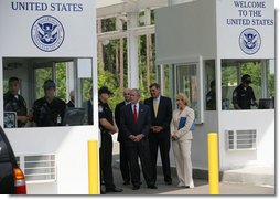 President George W. Bush listens as Ed Cassidy, Assistant Director of U.S. Customs and Border Protection, explains the procedures at a simulated border crossing during in a tour Tuesday, May 29, 2007, of the Federal Law Enforcement Training Center in Glynco, Ga. The President spent the day in Georgia where he was briefed on wildfires and also delivered remarks on comprehensive immigration reform.  White House photo by Eric Draper