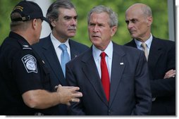 President George W. Bush listens to Ed Cassidy, Assistant Director of U.S. Customs and Border Protection, during a tour Tuesday, May 29, 2007, of the Federal Law Enforcement Training Center in Glynco, Ga. Joining the President are Secretary Michael Chertoff of the Department of Homeland Security, and Secretary Carlos Gutierrez of the Department of Commerce.  White House photo by Chris Greenberg