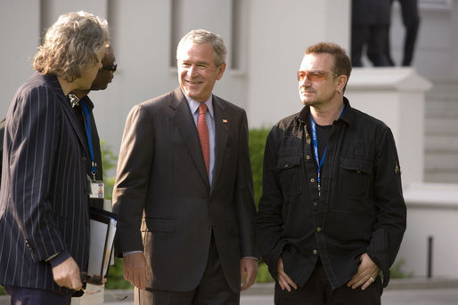 President George W. Bush shares a moment with Irish rocker Bono, Sir Bob Geldof, left, and Senegalese singer Youssou N'Dour Wednesday, June 6, 2007, the Kempinski Grand Hotel in Heiligendamm, Germany, site of the 2007 G8 Summit. White House photo by Shealah Craighead