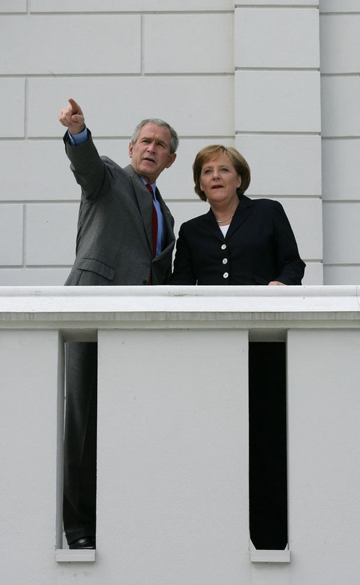 President George W. Bush and German Chancellor Angela Merkel stand on a balcony at the Kempinski Grand Hotel Wednesday, June 6, 2007, in Heiligendamm, Germany, site of the 2007 G8 Summit. White House photo by Eric Draper