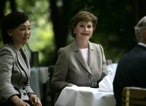 Mrs. Laura Bush sits with Mrs. Akie Abe during coffee Thursday, June 7, 2007, in the Castle Garden at Burg Schlitz in Hohen Demzin, Germany. White House photo by Shealah Craighead
