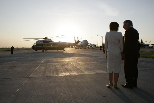 Polish President Lech Kaczynski and his wife, Maria, wait to greet President George W. Bush and Mrs. Laura Bush arriving aboard Marine One, on their trip back to Gdansk after visiting the presidential retreat in Jurata, Poland, Friday, June 8, 2007. White House photo by Eric Draper
