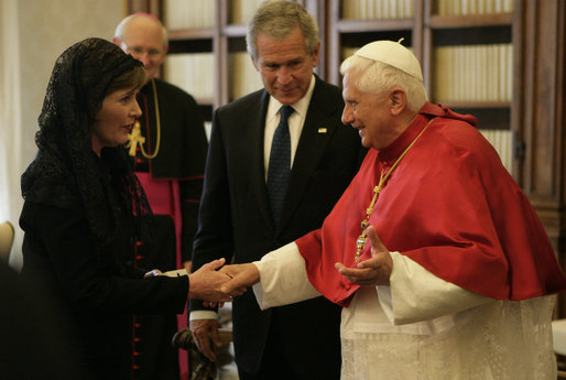 As President George W. Bush looks on, Mrs. Laura Bush shakes the hand of Pope Benedict XVI Saturday, June 9, 2007, during their visit to The Vatican in Rome. White House photo by Eric Draper