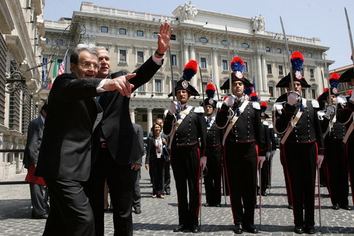 Italy's Prime Minister Romano Prodi points to someone in the courtyard audience as he welcomes President George W. Bush to Chigi Palace Saturday, June 9, 2007. The President and Mrs. Bush are scheduled to depart Rome Sunday for Albania and Bulgaria. White House photo by Chris Greenberg